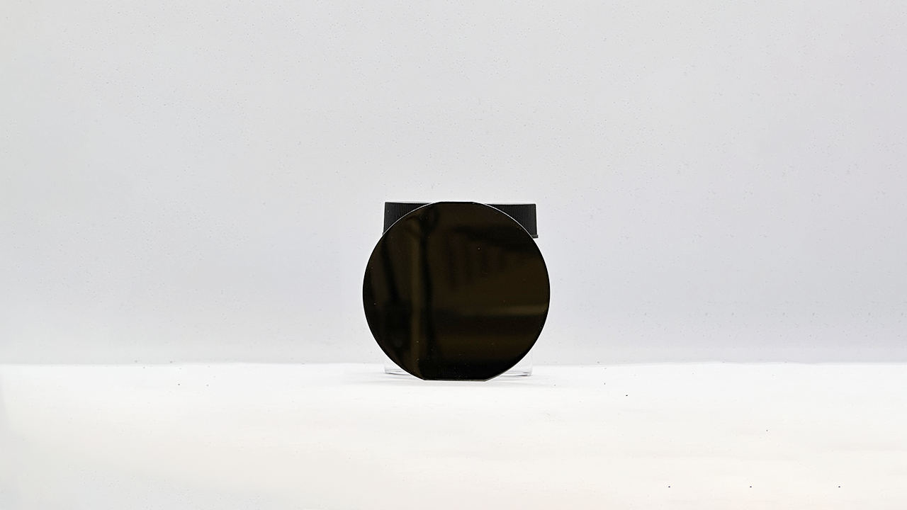 Silicon wafer in front of vials, visible spectrum